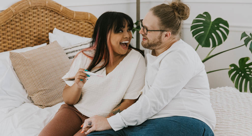 woman holding a positive pregnancy test