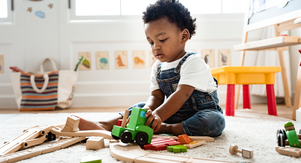 little boy playing with blocks