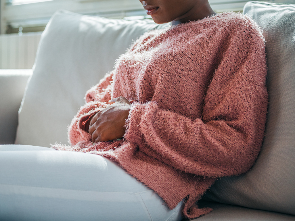 young woman holding her stomach