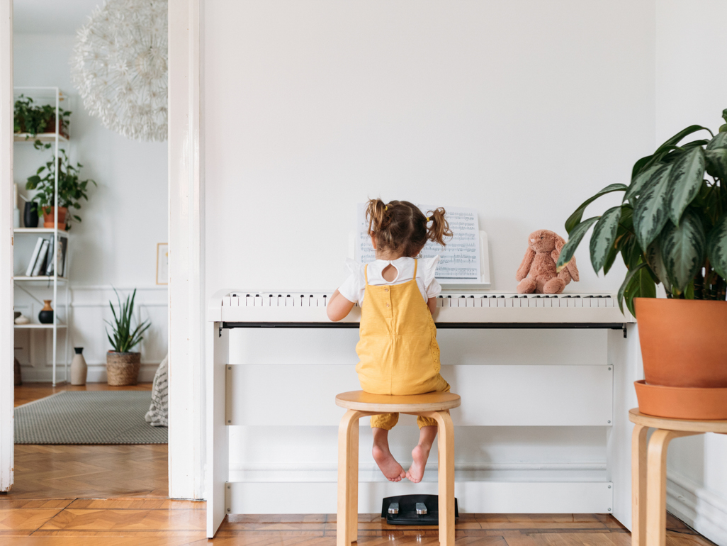 little girl playing the piano