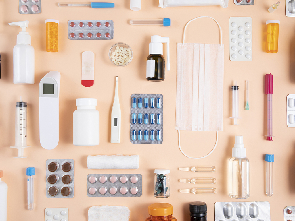various medication and first aid supplies atop a table