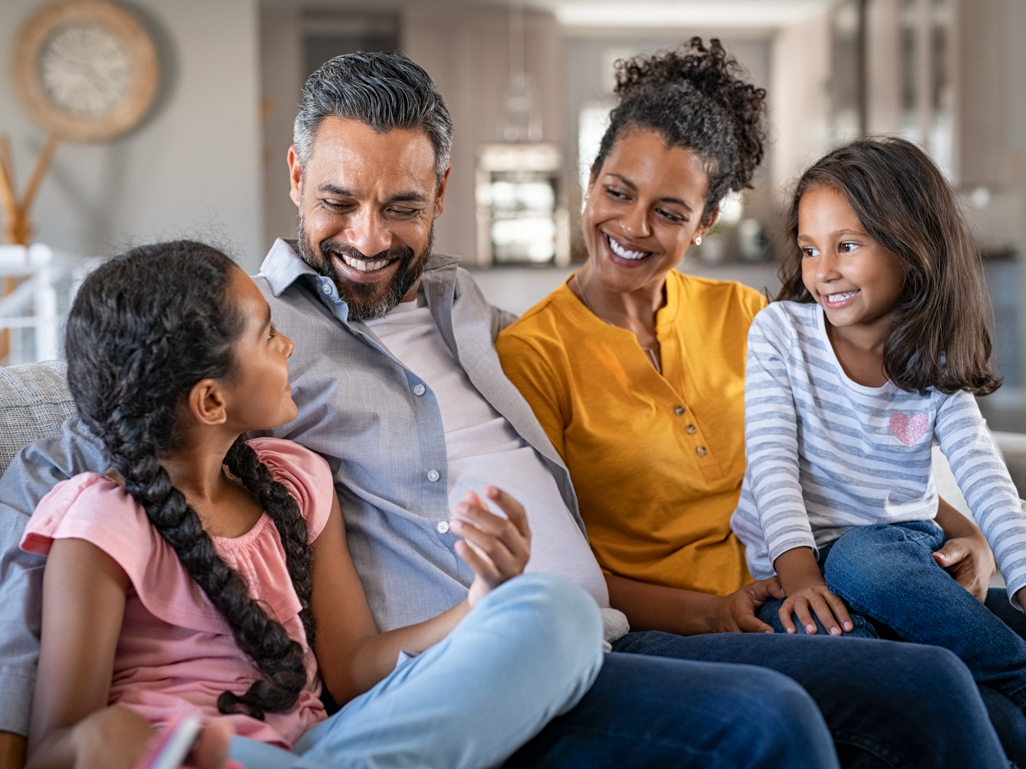 family sitting together on the couch