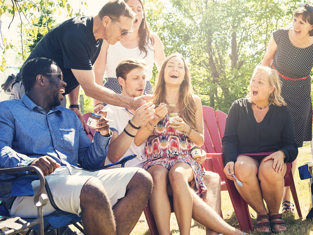 friends outside playing a baby shower game