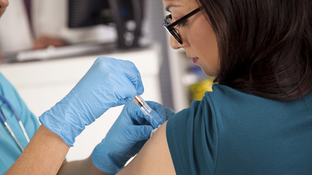 Pregnant woman getting injection