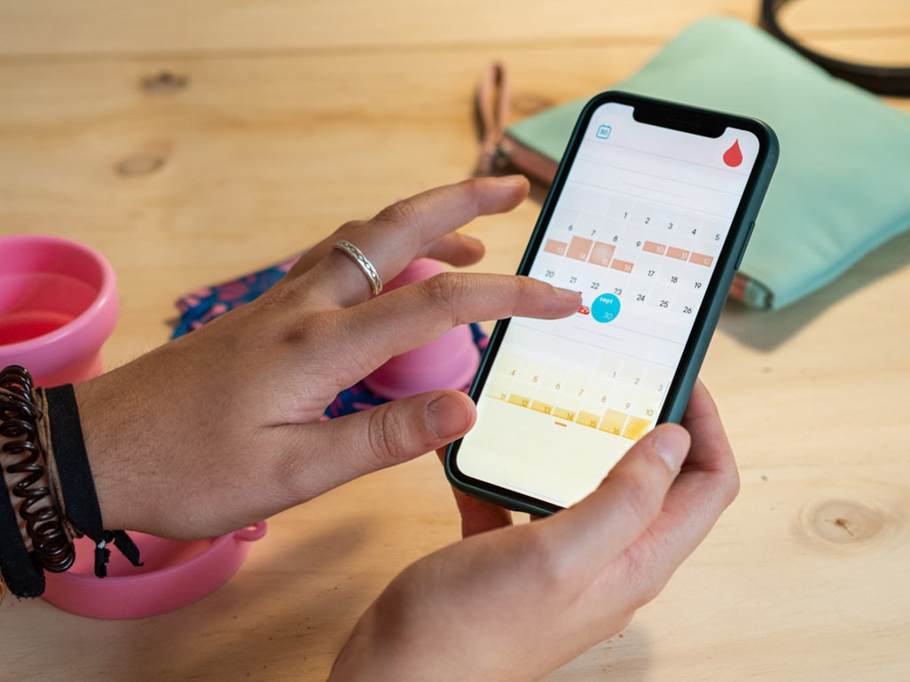 Woman tracking menstrual cycle